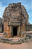 Angkor - Eastern Mebon - towered passageways leading to the first enclosure of the temple,  with stone lions guarding the entrance.